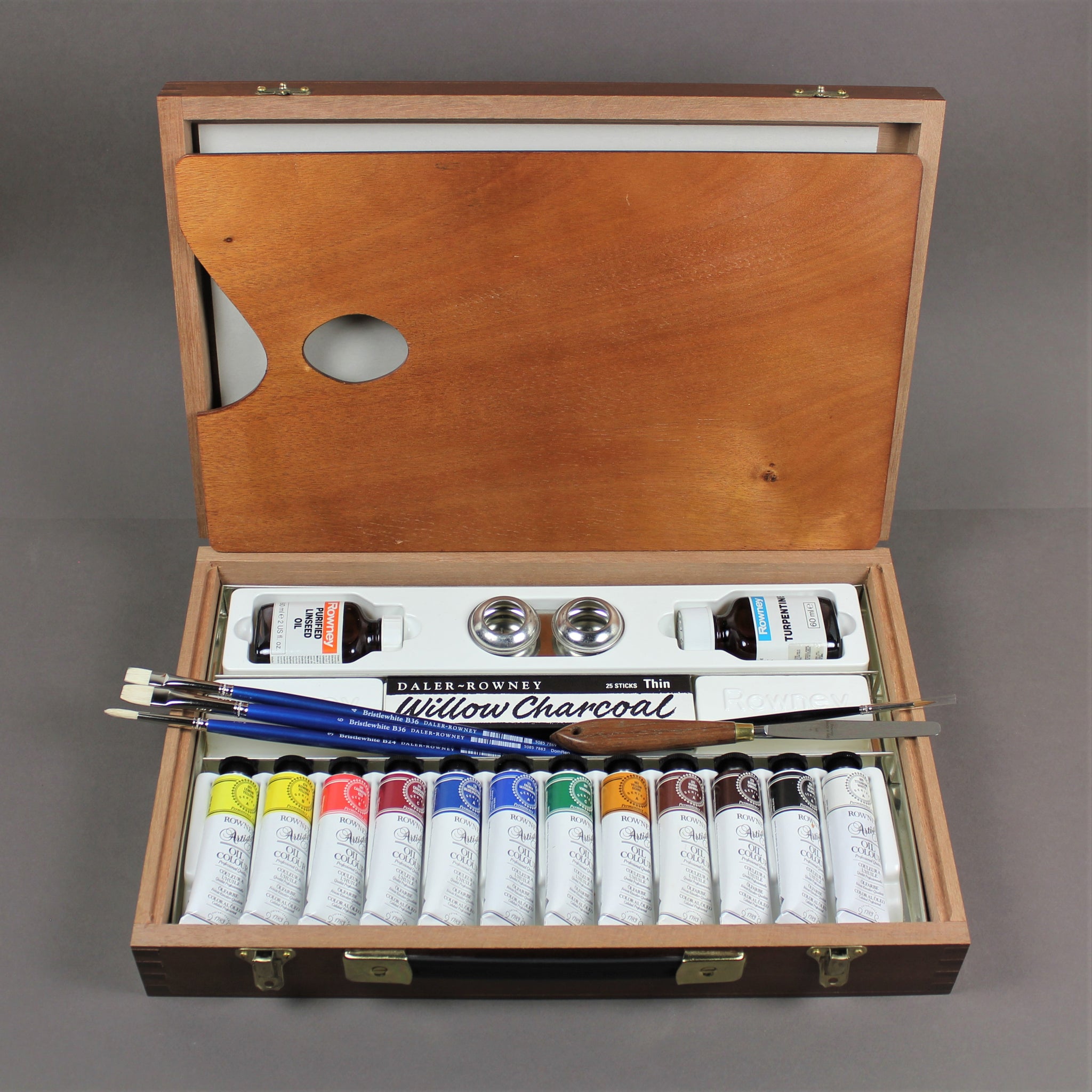 Artists Oil Paint Tubes Open and Used on a Wooden Palette, with